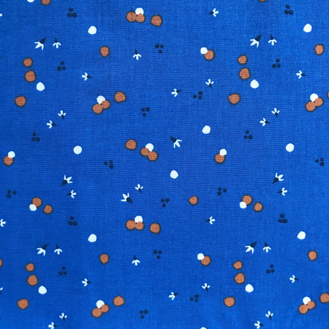 Coupon imprimé petits pois orange sur fond bleu foncé