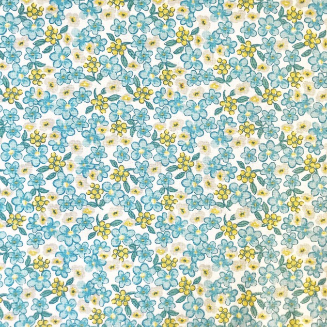 Coupon imprimé fleurs bleus et jaunes sur fond blanc